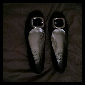 Black flats with silver buckles
