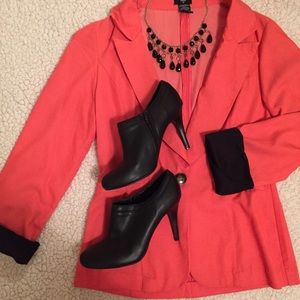 Pink/coral blazer with black rolled cuffs. Small.