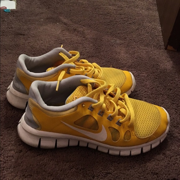 Yellow Nike free runs