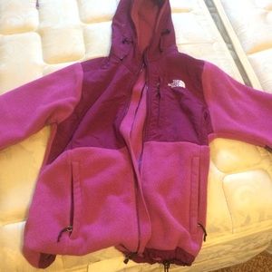 Maroon colored north face jacket