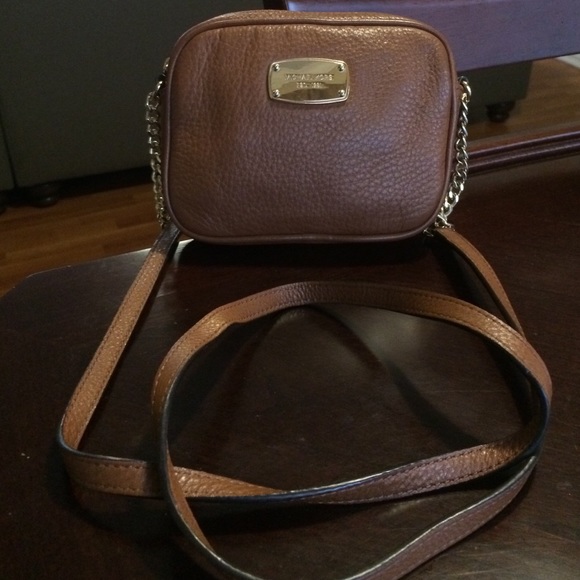 Authentic Michael Kors cross body wallet.