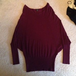 Oversized, yet fitted maroon sweater