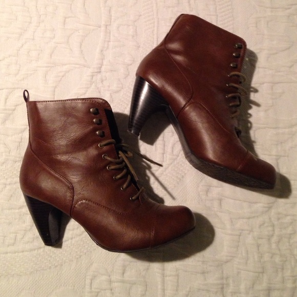 Brown lace-up heeled bootie.