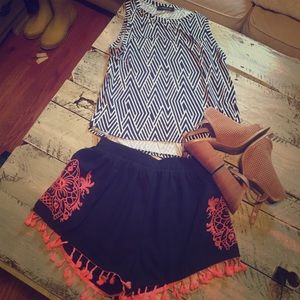 A. PEACH. Navy blue with pink fringe and detail.