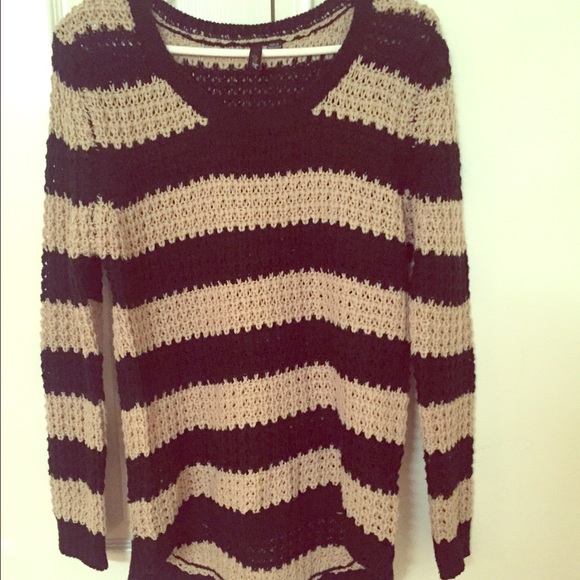 100% acrylic striped tan and black sweater.