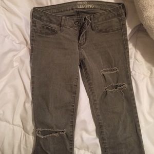 Distressed olive green legging jeans