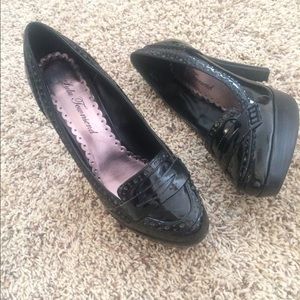 Black closed toe heeled platform.  Size 6.5
