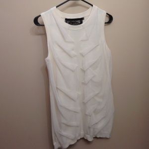 Cream colored vest or sleeveless top