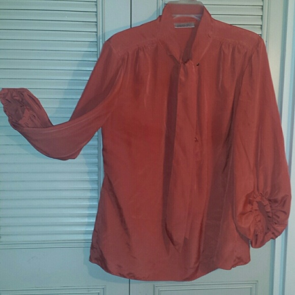 Jennifer Lopez deep coral blouse