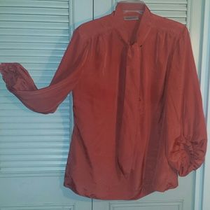 Jennifer Lopez deep coral blouse