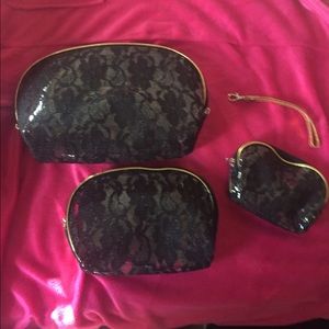 Four piece black lace makeup bag set