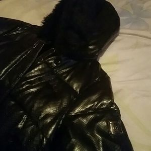 A rock wear coat with fur on the hood