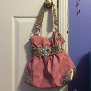 Pink purse. Do not know which brand.