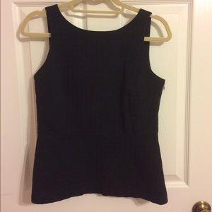 Sleeveless black peplum top with side zip