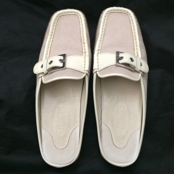 Tod's cream colored slip on loafers.
