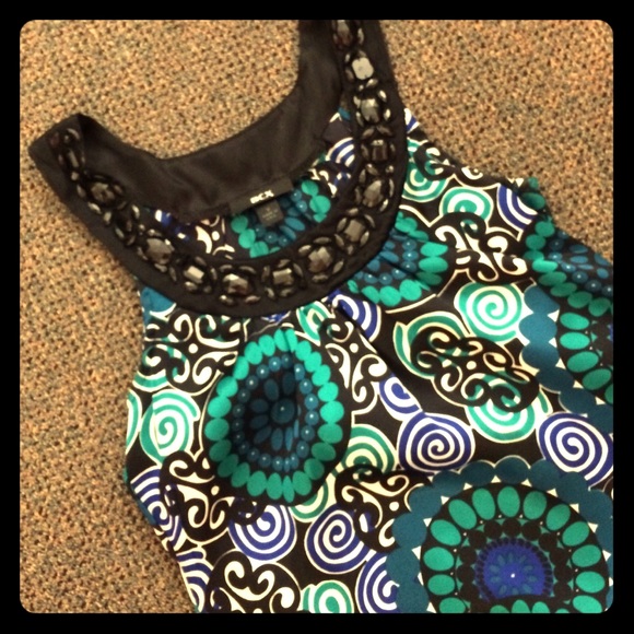 Colors and bedazzling, great top