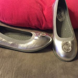 Children's silver Michael Kors flats.
