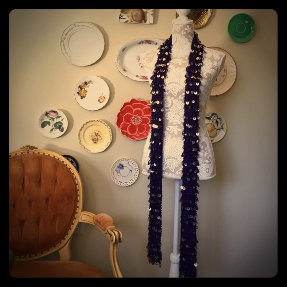 Purple knit skinny scarf w/silver palettes.