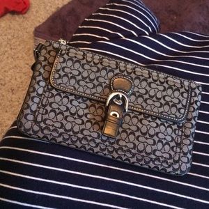 Black COACH wristlet. 😍