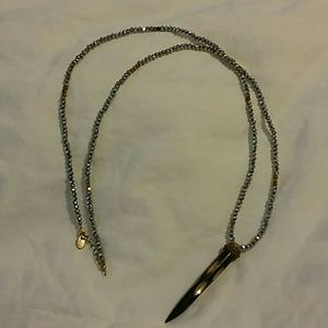 Silver and gold bead necklace with small horn pend