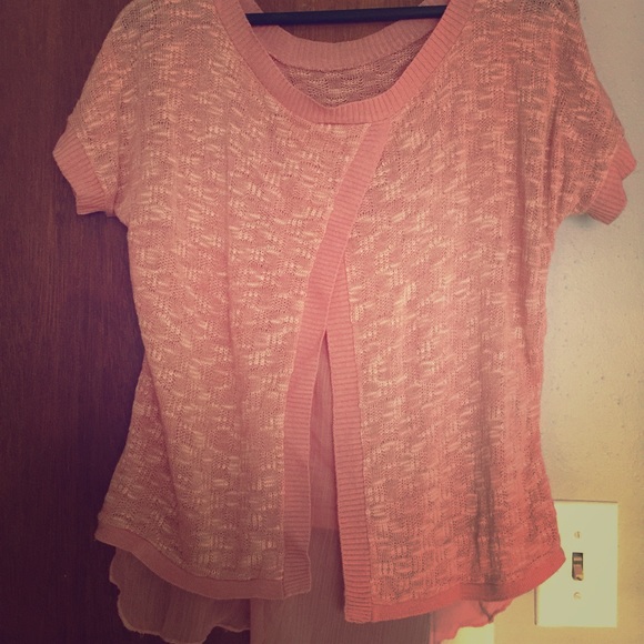 Pink open back sweater shirt.