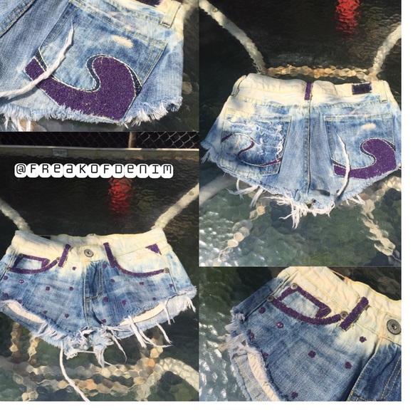 Distressed denim shorts with purple beading