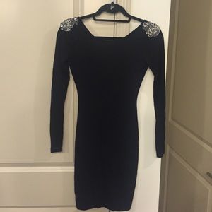Long sleeve black dress with embellished shoulders