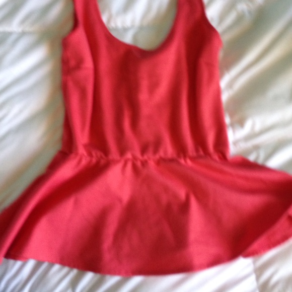 Pink tank top with flare at bottom