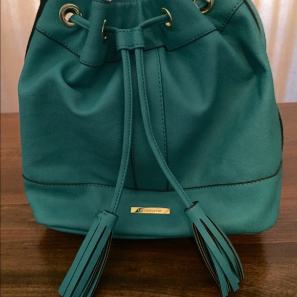 LIKE NEW TURQUOISE HANDBAG WITH DRAWSTRING ACCENT