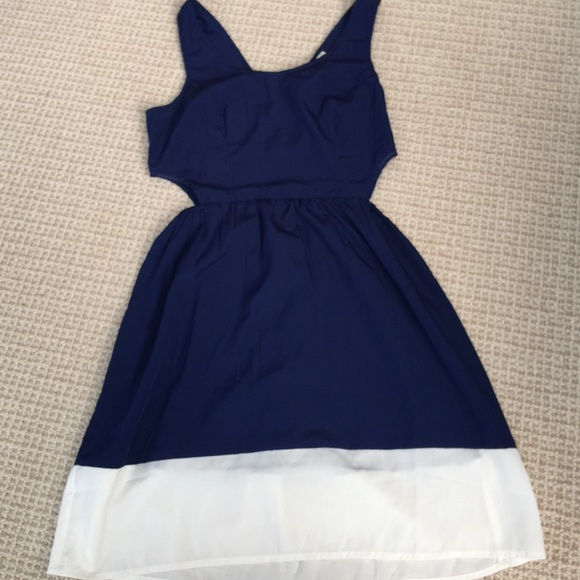Navy dress with white trim and side cut outs