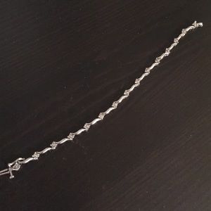 10k white gold diamond bracelet. Safety clasp.