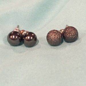 Both pair of dark steel grey/black earrings.