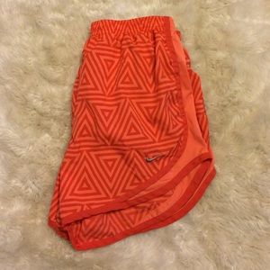 orange Nike tempo shorts