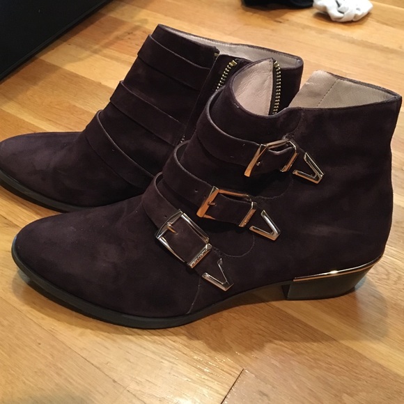 Brown suede booties with gold accents