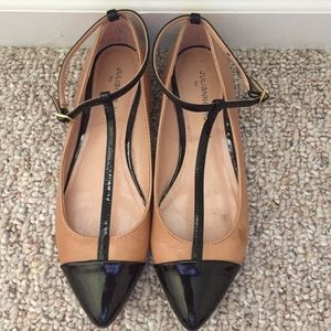 Beige and black flats.