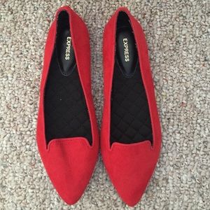 Red pointed toe flats.