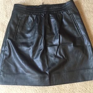 Black faux leather mini skirt