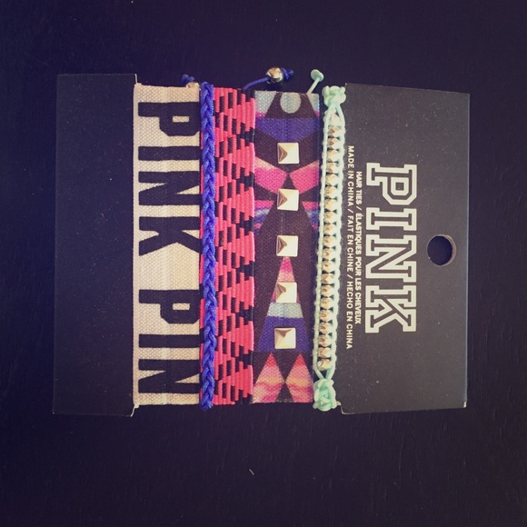 Pink hair ties and bracelets.