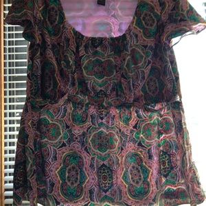 Cute top it says size 18/20 but fits more like 16