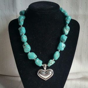 Turquoise and silver heart necklace.
