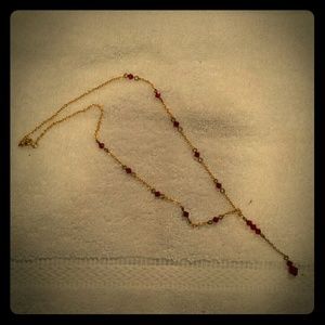 Gold chain necklace with red diamond shaped beads