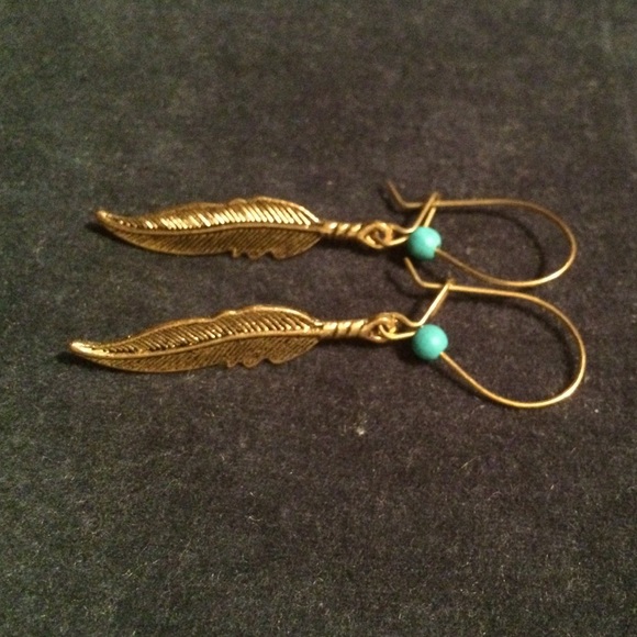 Gold feather earrings