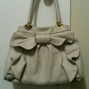 Adorable cream bow handbag