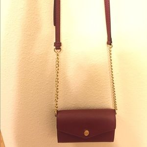 Michael Kors clutch. Perfect cinnabar color