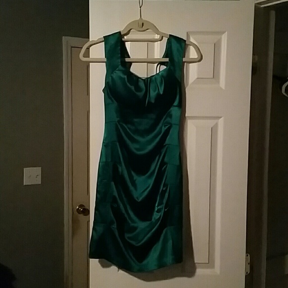 A green fitted colored cocktail dress