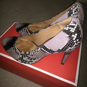 COACH snakeskin pumps