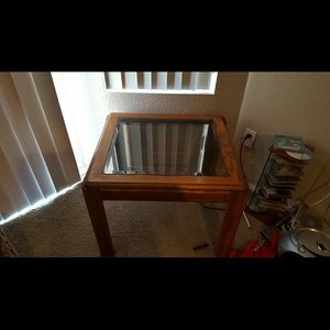 a set of glass top end tables