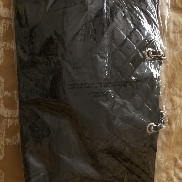 Large DSW tote with small cosmetic bag inside. - Picture 2 of 4