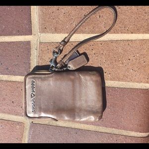 Tan Coach wristlet