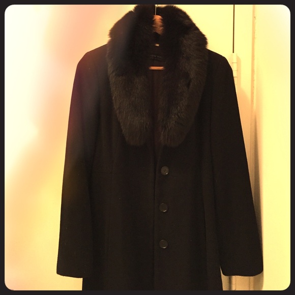 A long wool winter coat with authentic fox fur